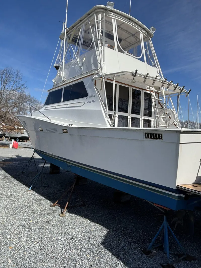 Slide: The Image of 1973 Viking 40 boat with diesel engines, on dry dock, clear sky background. - 2