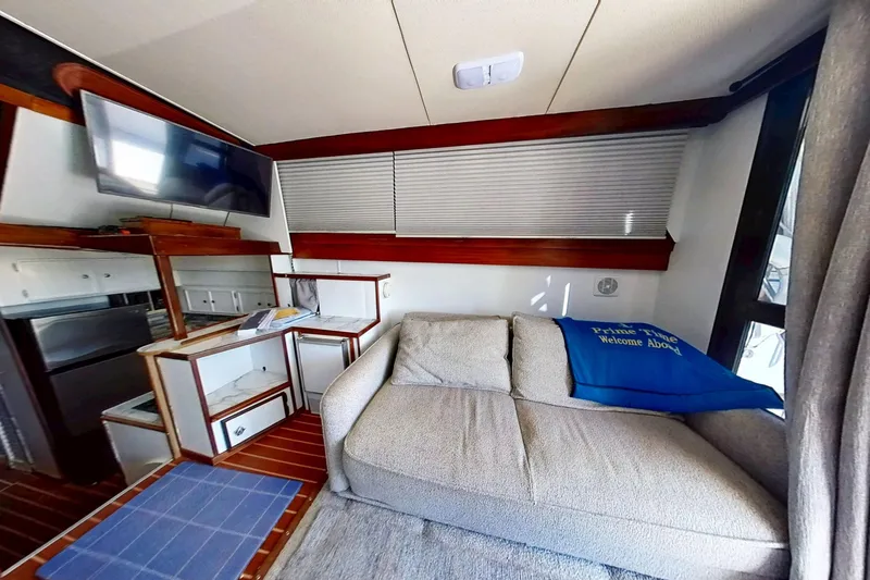 Slide: The Image of 1973 Viking 40 interior with sofa, TV, and kitchenette in restored condition. - 20
