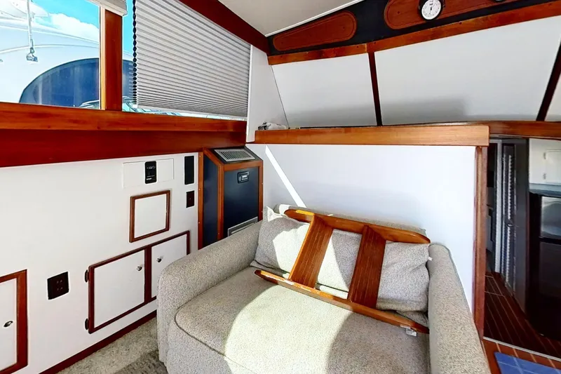 Slide: The Image of 1973 Viking 40 yacht interior with restored wood accents and cozy seating area. - 21