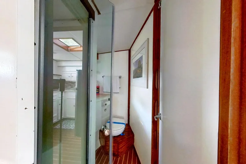 Slide: The Image of Restored 1973 Viking 40 interior with modern bathroom and kitchen features. - 32