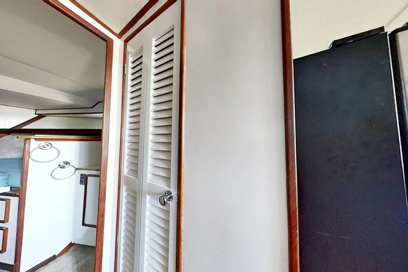 Slide: The Image of Interior of a 1973 Viking 40 boat, featuring restored wood paneling and modern fixtures. - 33