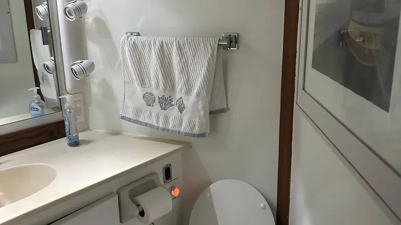 Slide: The Image of Bathroom interior of a 1973 Viking model, featuring a towel and modern fixtures. - 39