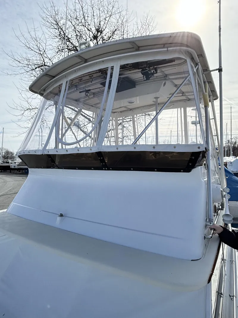 Slide: The Image of Viking 40 boat, 1973 model, with 2007 diesel engines, docked under a bright sky. - 7