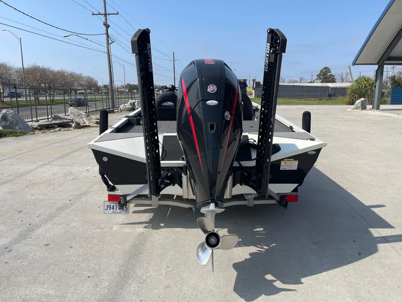 Slide: The Image of 2021 Crestliner 21 MX boat, rear view with motor and dual power poles. - 2