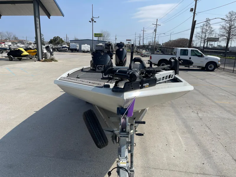 Slide: The Image of 2021 Crestliner 21 MX boat on trailer in outdoor dealership lot. - 7