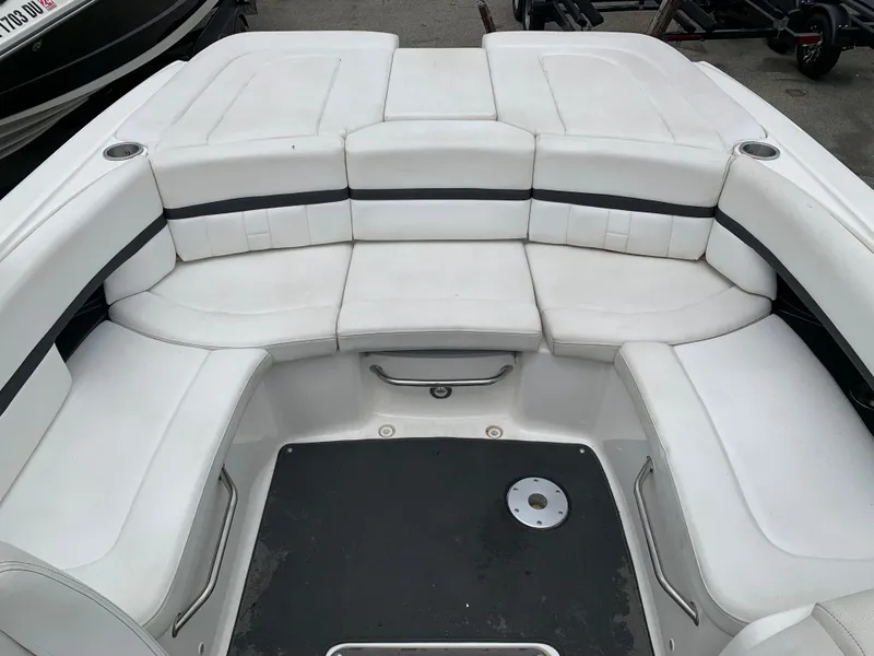 Slide: The Image of 2015 Sea Ray 250 SLX boat with spacious white seating area. - 10