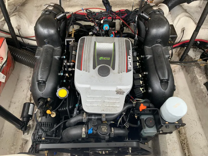 Slide: The Image of Engine of a 2015 Sea Ray 250 SLX boat, showcasing detailed components. - 11