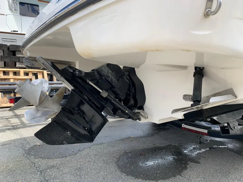 Slide: The Image of 2015 Sea Ray 250 SLX boat stern with propeller and outdrive visible. - 14