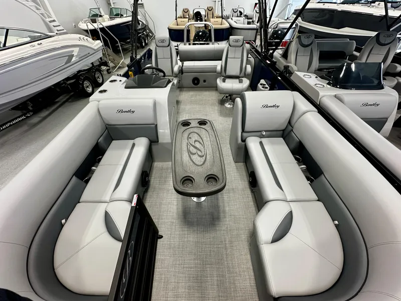 Slide: The Image of 2025 Bentley Pontoons 223 Swingback interior with luxurious seating and modern design. - 2