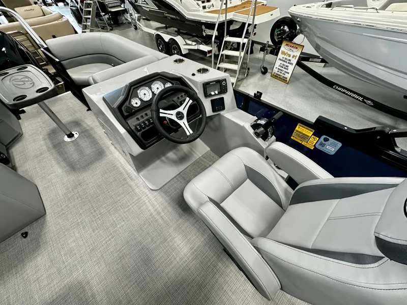 Slide: The Image of 2025 Bentley Pontoons 223 Swingback interior with modern dashboard and seating. - 3
