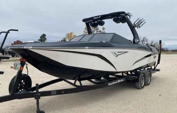 Slide: The Image of 2024 Tigé Z5 boat on trailer, sleek design, black and white color scheme. - 2