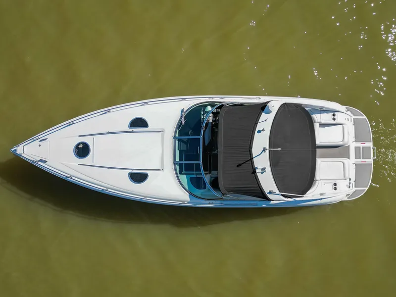 Slide: The Image of Overhead view of a 2004 Cobalt 360 boat on water. - 12