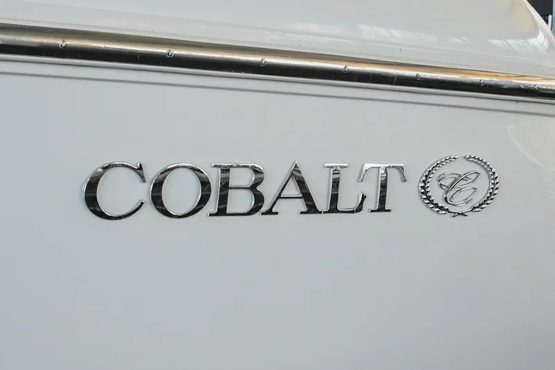 Slide: The Image of Cobalt 360 boat emblem, 2004 model, featuring chrome lettering on a white surface. - 15