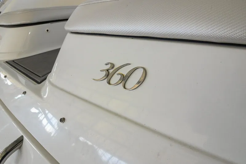 Slide: The Image of Close-up of 2004 Cobalt 360 boat emblem on white surface. - 16