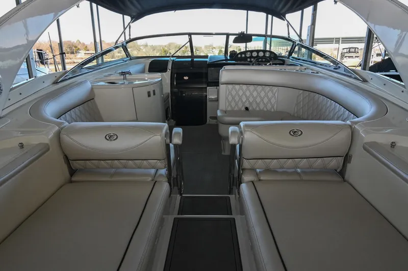 Slide: The Image of Interior of a 2004 Cobalt 360 boat with luxurious seating and helm. - 20