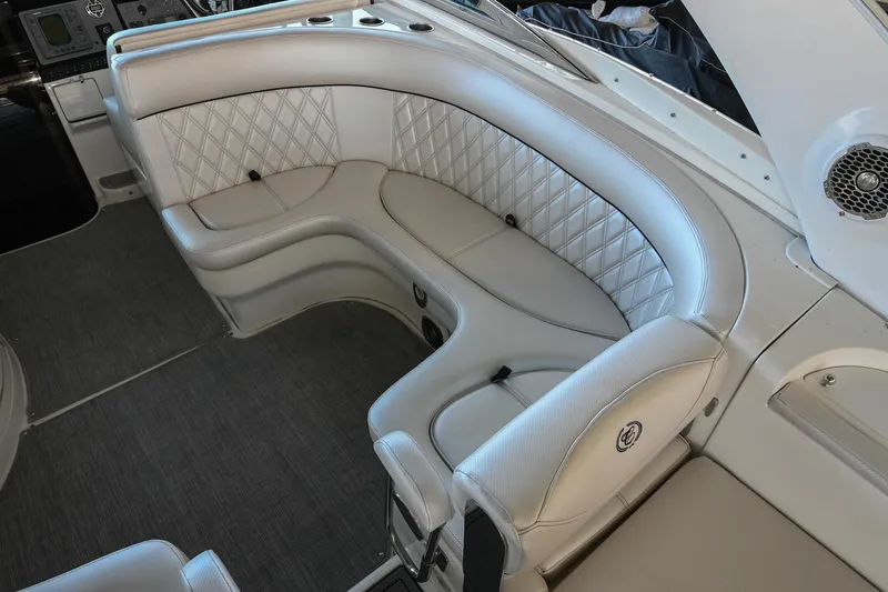 Slide: The Image of Luxurious seating in a 2004 Cobalt 360 boat with elegant diamond-pattern upholstery. - 32