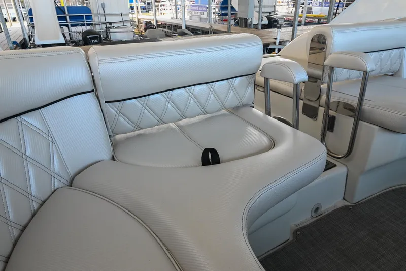 Slide: The Image of Luxurious seating on a 2004 Cobalt 360 boat with white leather upholstery. - 35