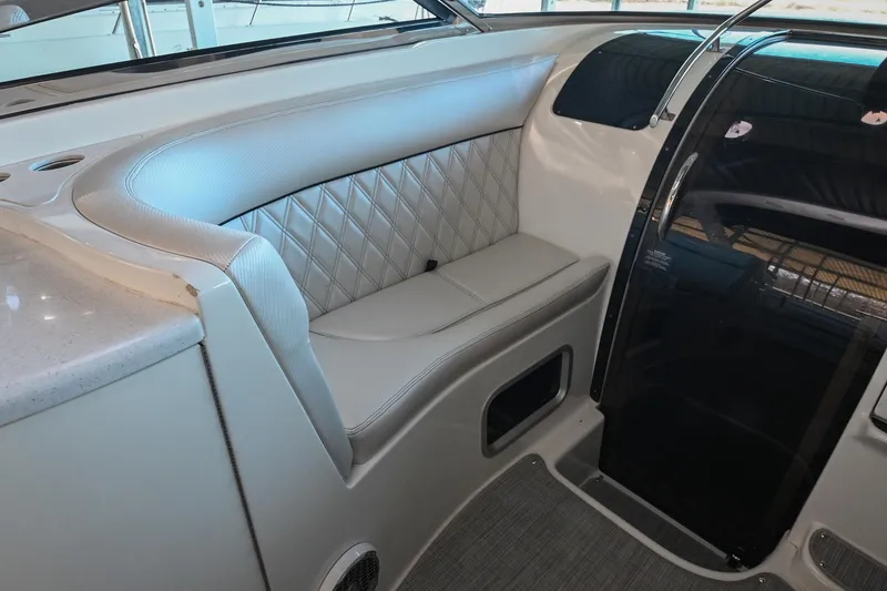 Slide: The Image of Luxurious seating area in a 2004 Cobalt 360 boat interior. - 44