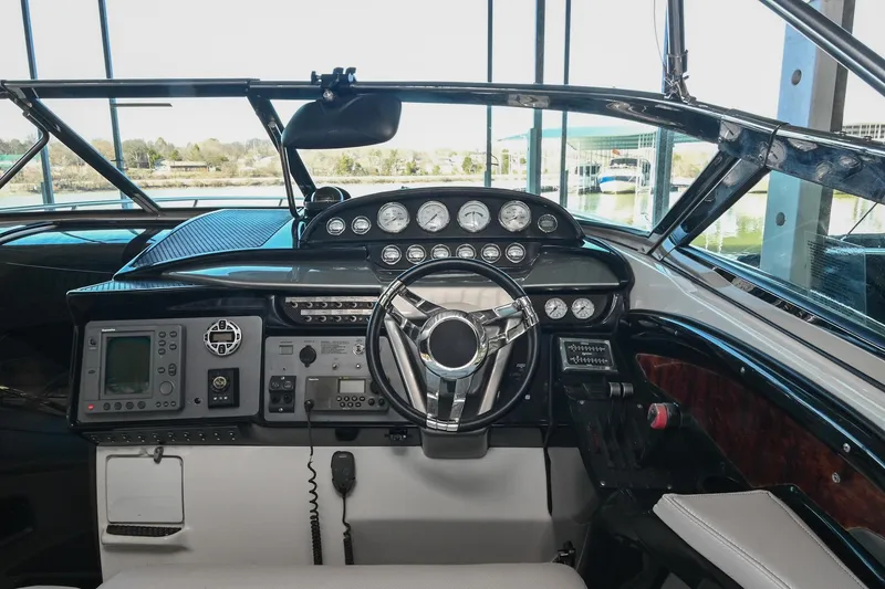Slide: The Image of Cockpit of a 2004 Cobalt 360 boat with steering wheel and instrument panel. - 46