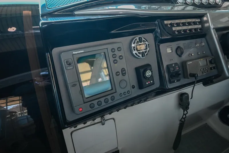 Slide: The Image of Control panel of a 2004 Cobalt 360 boat with navigation equipment. - 48