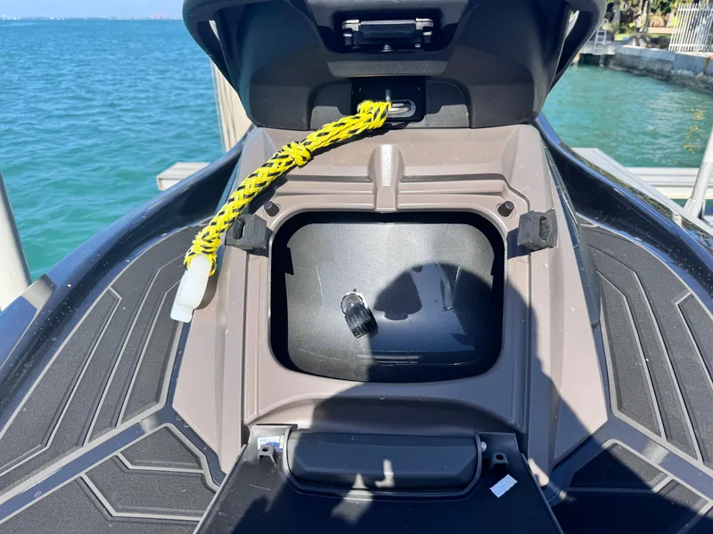 Slide: The Image of 2023 Yamaha WaveRunner FX Cruiser H/O storage compartment by the water. - 5