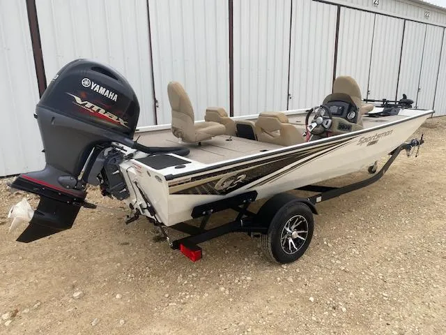 Slide: The Image of 2024 G3 Sportsman 1710 boat with Yamaha engine, parked on gravel. - 5