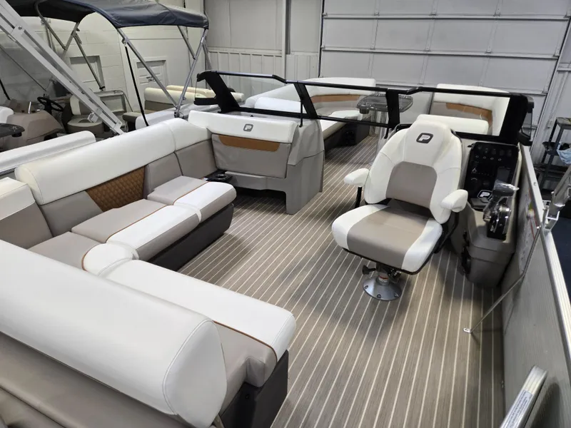 Slide: The Image of 2025 Princecraft Vectra 23 WRL pontoon boat interior with modern seating and helm. - 10