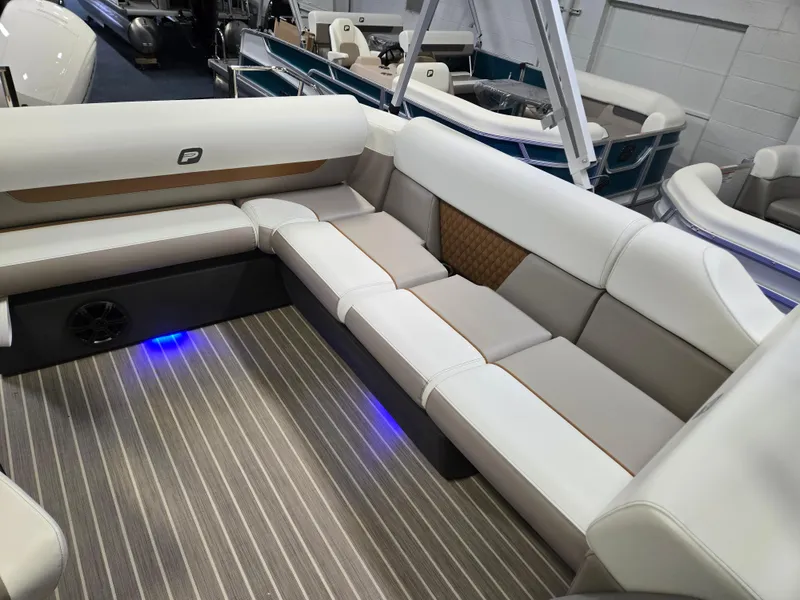 Slide: The Image of 2025 Princecraft Vectra 23 WRL boat interior with stylish seating and ambient lighting. - 11