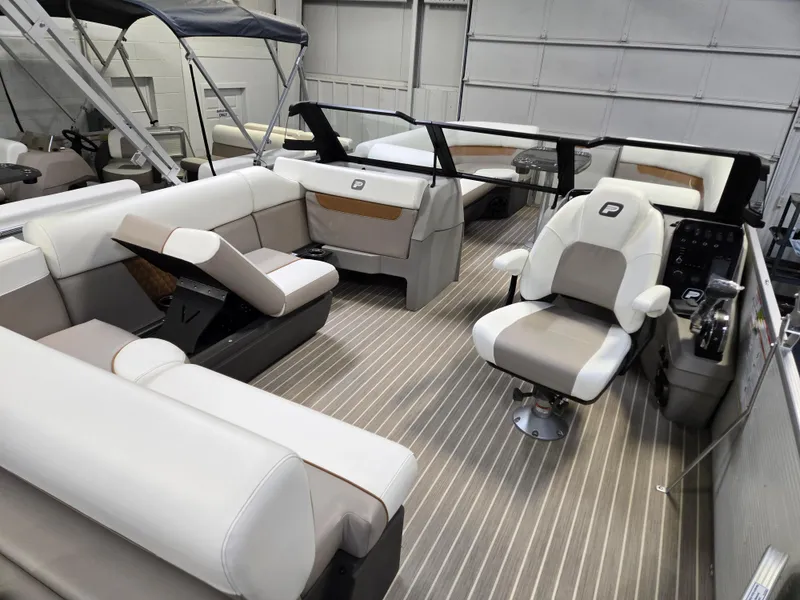 Slide: The Image of 2025 Princecraft Vectra 23 WRL boat interior with plush seating and modern helm. - 13