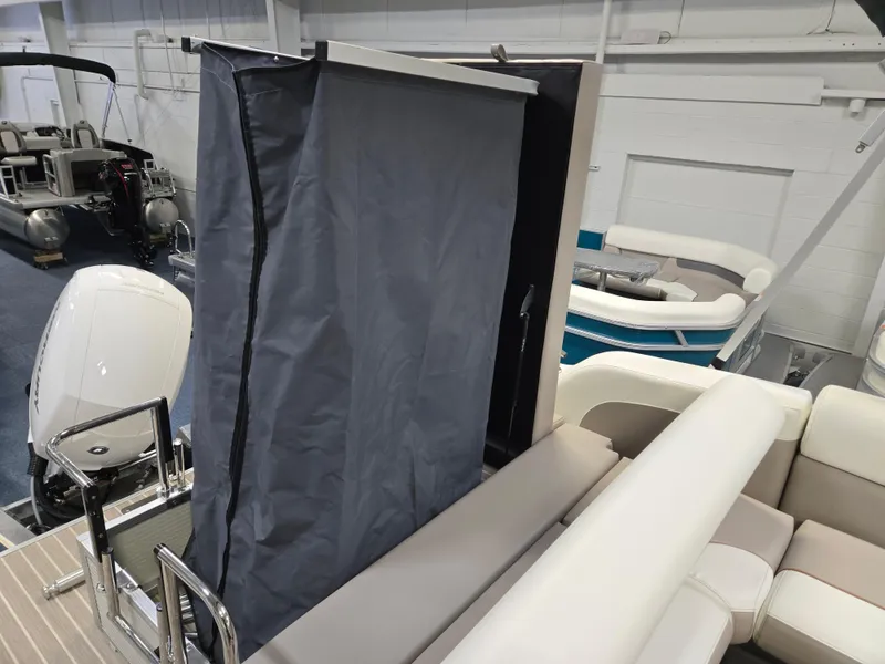 Slide: The Image of 2025 Princecraft Vectra 23 WRL boat interior with privacy curtain and seating. - 9