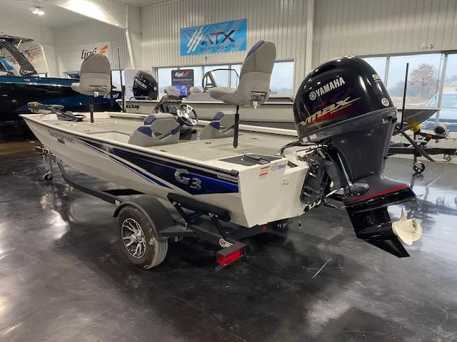 Slide: The Image of 2024 G3 Sportsman 1710 boat with Yamaha outboard motor in showroom. - 2
