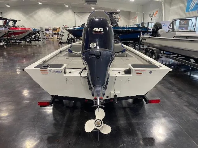 Slide: The Image of 2024 G3 Sportsman 1710 boat with 90 HP engine displayed indoors. - 3