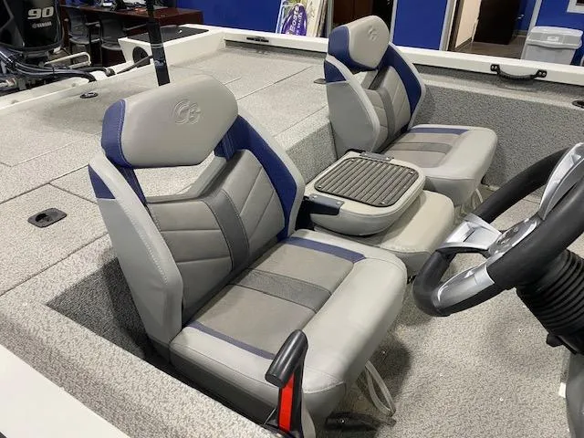 Slide: The Image of 2024 G3 Sportsman 1710 boat interior with gray and blue seating. - 5