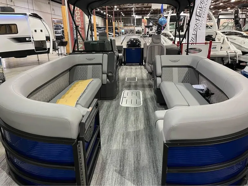 Slide: The Image of 2025 Bennington M 24 Fastback SE pontoon boat interior with spacious seating and modern design. - 3