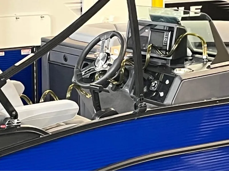 Slide: The Image of Interior of 2025 Bennington M 24 Fastback SE boat with steering wheel and dashboard. - 6