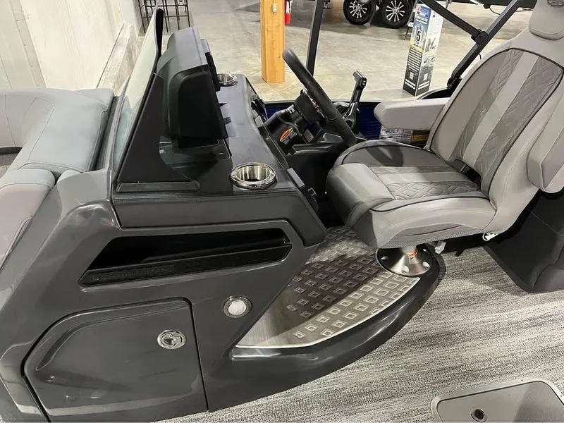 Slide: The Image of 2025 Bennington M 24 Fastback SE boat interior with modern helm and seating. - 9