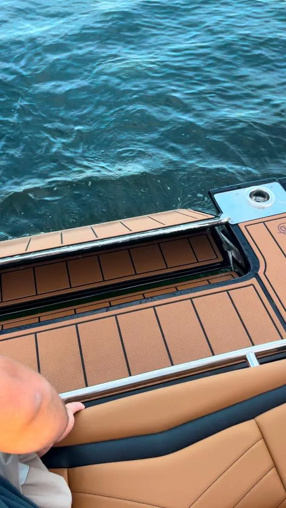 Slide: The Image of 2021 Chaparral 267 SSX boat deck with water view. - 13