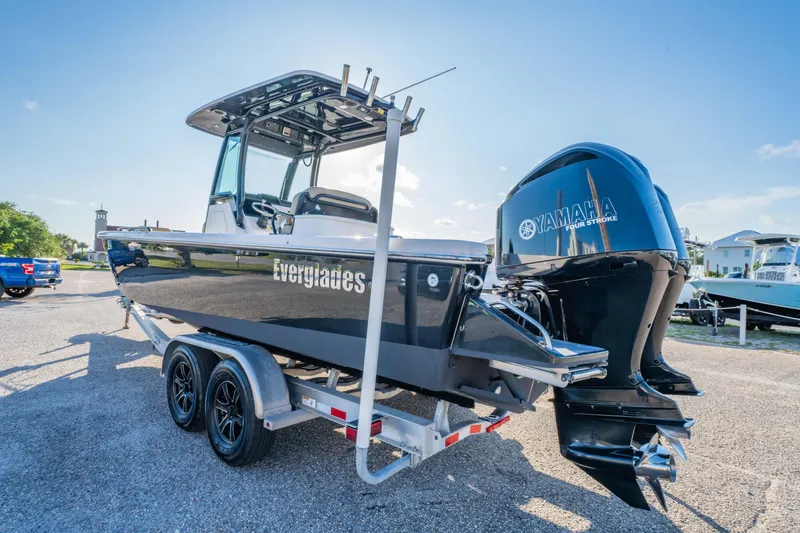 Slide: The Image of 2019 Everglades 273CC boat on trailer, front view, outdoors. - 13