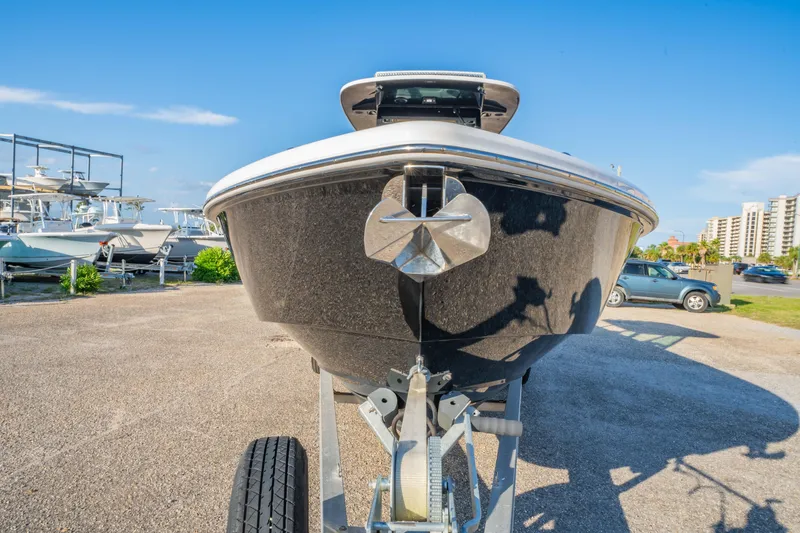 Slide: The Image of 2019 Everglades 273CC boat with Yamaha engines, docked near urban buildings. - 15