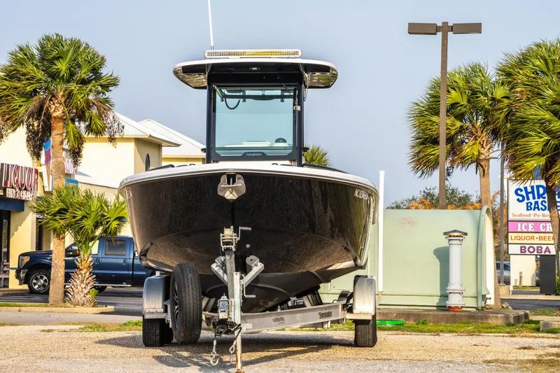 Slide: The Image of Twin Yamaha 250 engines on a 2019 Everglades 273CC boat, docked in a marina. - 17