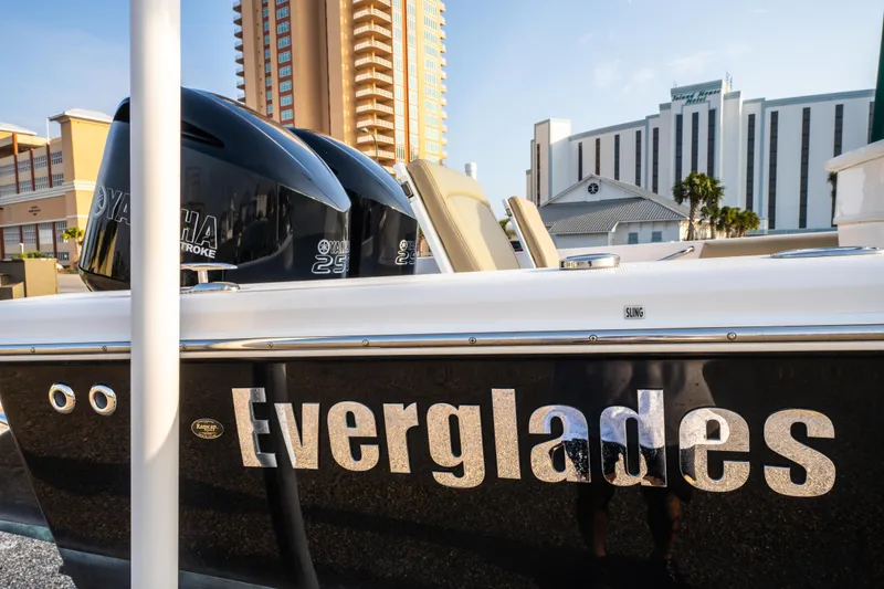 Slide: The Image of 2019 Everglades 273CC boat interior with seating and storage compartments. - 18