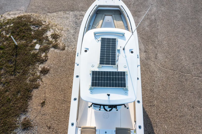 Slide: The Image of 2019 Everglades 273CC boat interior with beige seating and cup holders. - 22