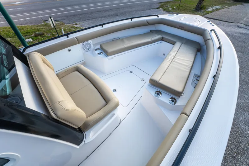 Slide: The Image of 2019 Everglades 273CC boat interior with helm, seating, and storage compartments. - 26