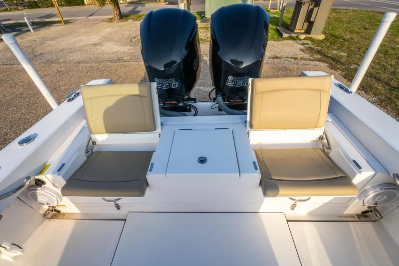 Slide: The Image of 2019 Everglades 273CC boat interior with seating and dual engines. - 27
