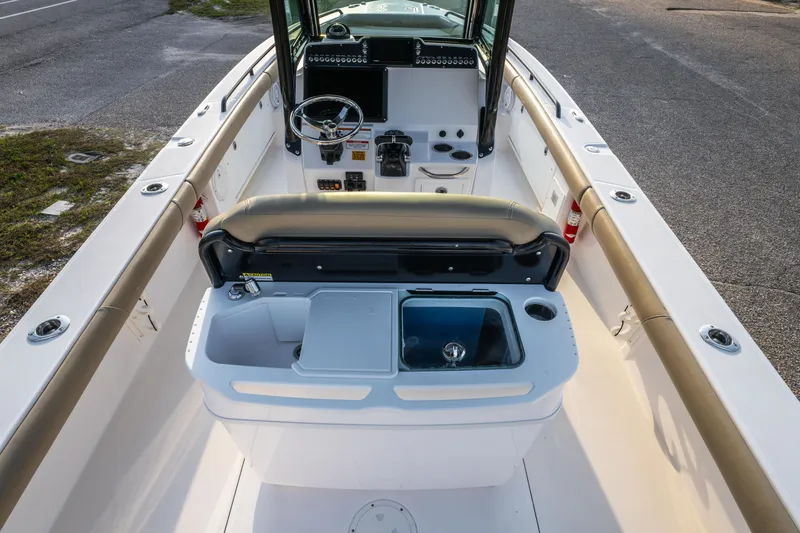 Slide: The Image of 2019 Everglades 273CC boat with open storage compartment and seating. - 29