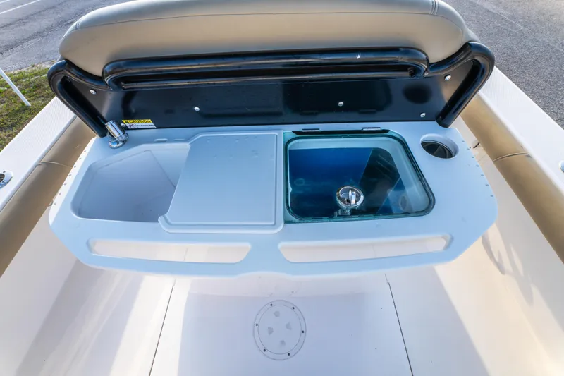 Slide: The Image of 2019 Everglades 273CC boat interior with steering console and seating area. - 32