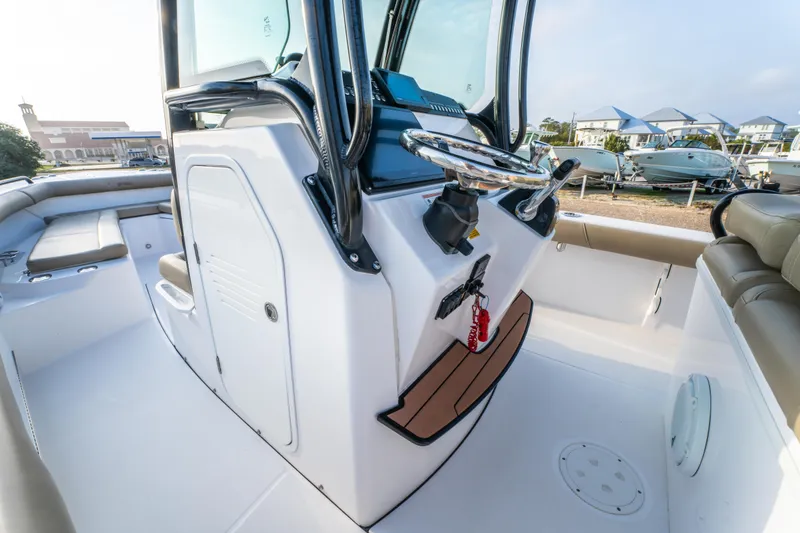 Slide: The Image of 2019 Everglades 273CC boat interior with beige seating and modern design. - 35