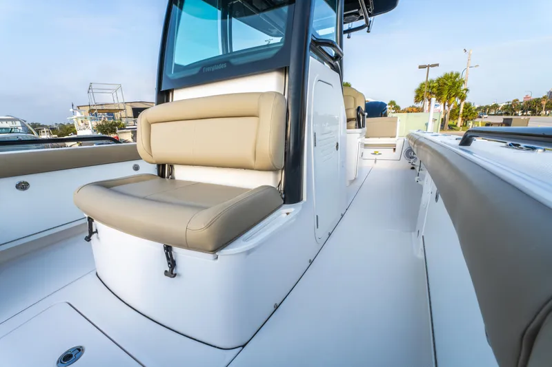 Slide: The Image of 2019 Everglades 273CC boat with cityscape background, featuring sleek design and spacious seating. - 36
