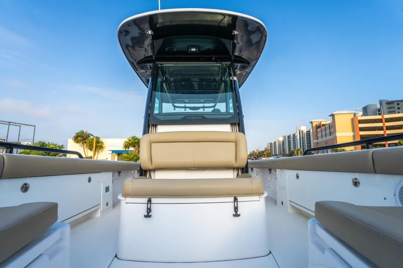 Slide: The Image of T-top of 2019 Everglades 273CC boat against a clear blue sky. - 37