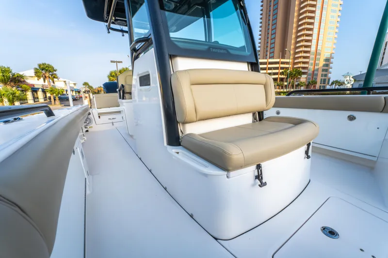 Slide: The Image of Control panel of a 2019 Everglades 273CC boat with navigation screens and controls. - 38